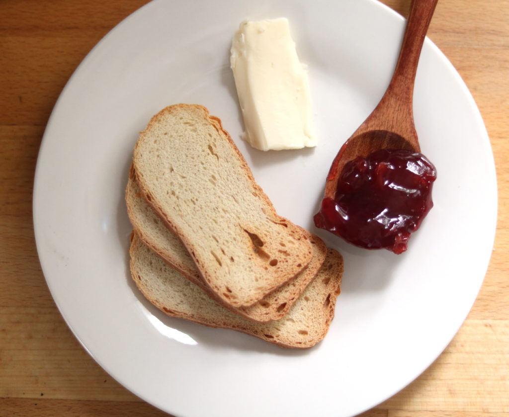 Brie Cheese with Cherry Perserves and Sliced Baguette